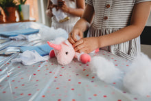 Load image into Gallery viewer, Girl making plush pink unicorn