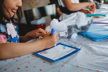 Load image into Gallery viewer, child fills out teddy birth certificate