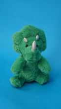 Charger l'image dans la visionneuse de la galerie, Green plush dinosaur toy on a blue background