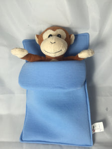 plush monkey in sleeping bag
