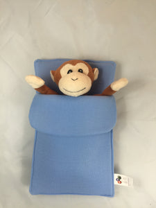 monkey plush pet in sleeping bag