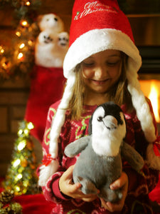 Girl with plush penguin