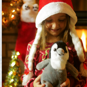 GIRL WITH PLUSH PENGUIN