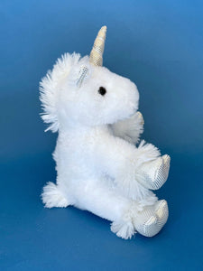 side view of plush white unicorn